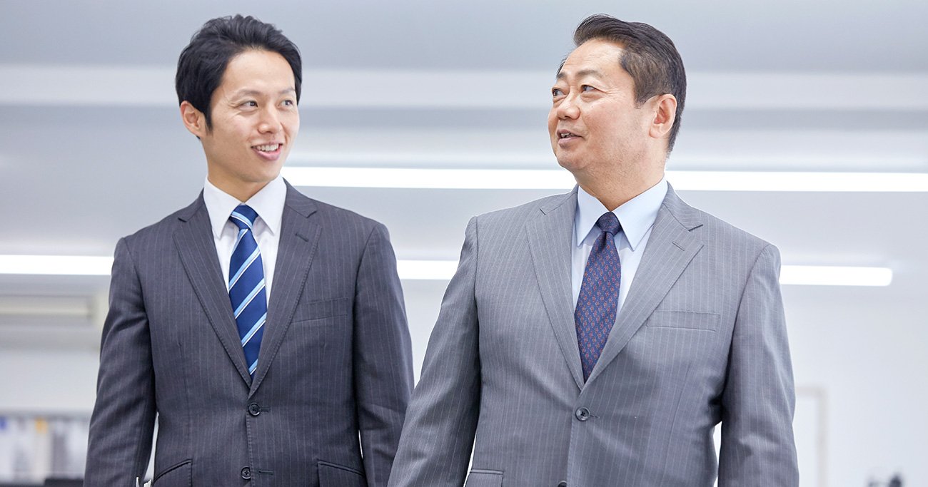 社員と話す社長