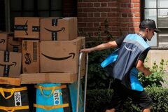 アマゾン「プライムデー」が象徴する強み、規制の標的に