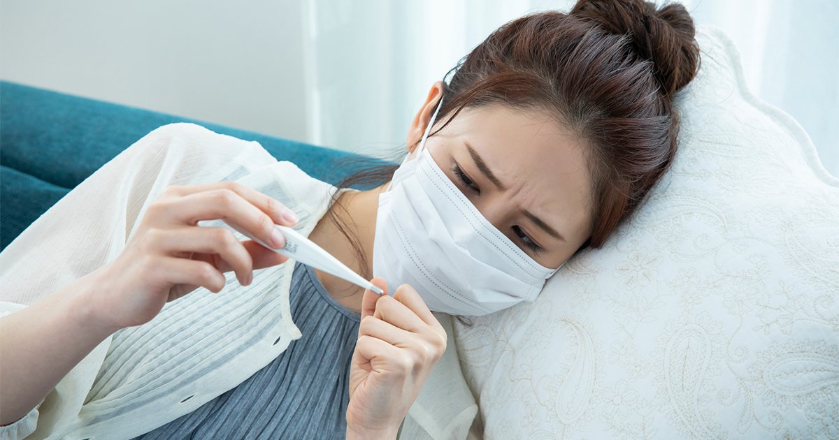 体調不良の女性