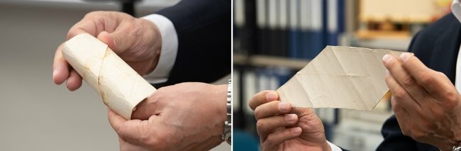 斜めにカットされたトイレットペーパーの芯を開く様子