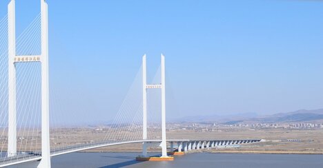 中朝を結ぶ大橋が開通へ、北朝鮮・新義州カジノタウン構想に潜む思惑