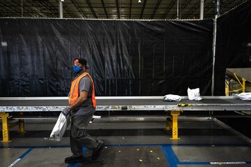 アマゾンが賃金・労働の基準に　業界超え波及