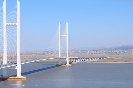 中朝を結ぶ大橋が開通へ、北朝鮮・新義州カジノタウン構想に潜む思惑